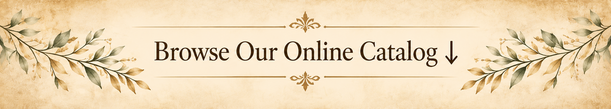 A horizontal banner with a parchment-style beige background and decorative leafy branches at the sides. Centered text reads 'Browse Our Online Catalog' with a downward arrow.