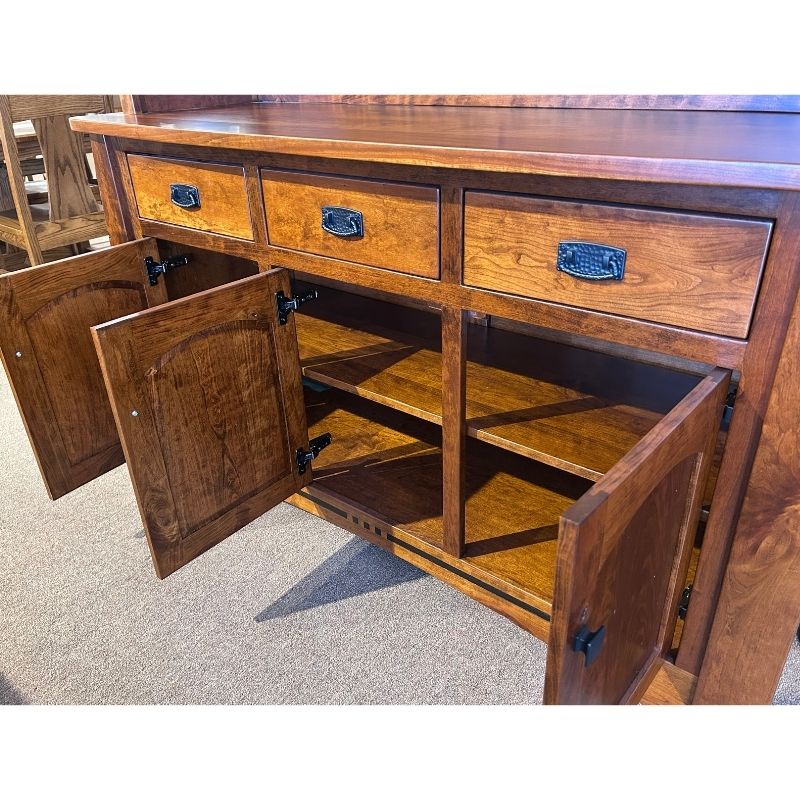 Close up view of the cherry wood buffet with drawers and open doors in a showroom setting - angled view - Amish Furniture Creations™