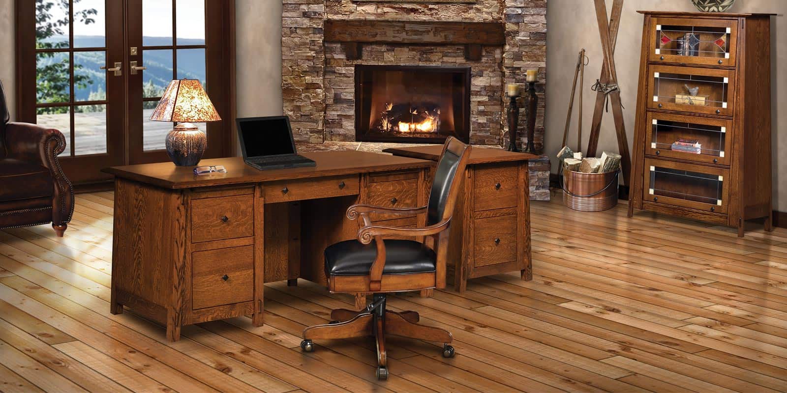 A desk with a lamp and a fireplace