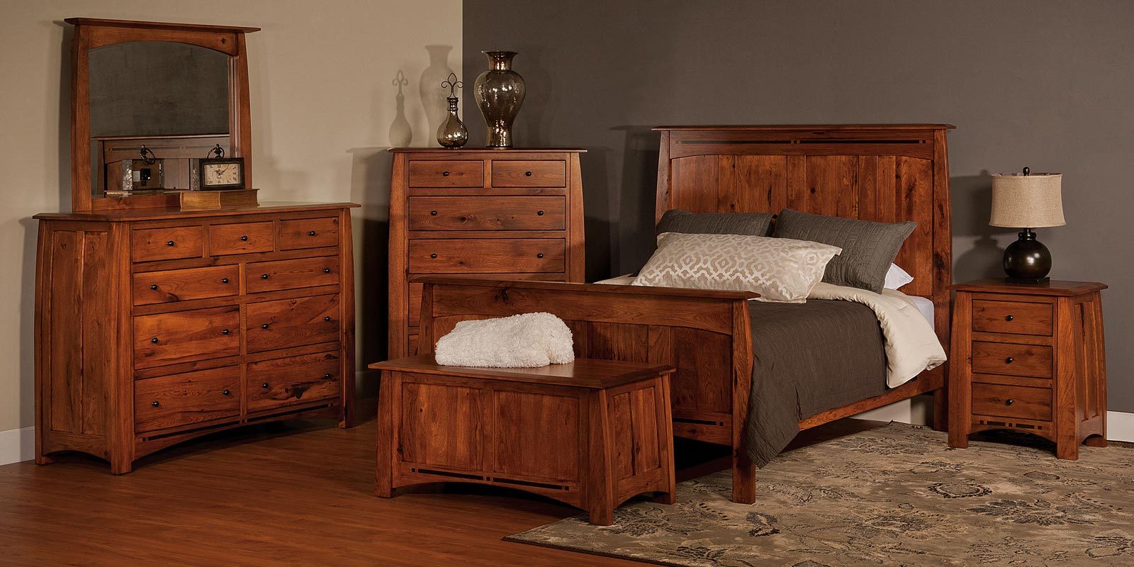 A bedroom set with a bed and a dresser
